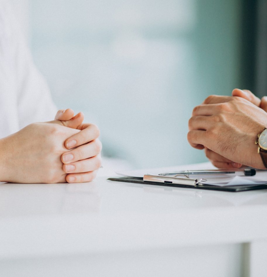 physician-consulting-his-patient-clinic-1